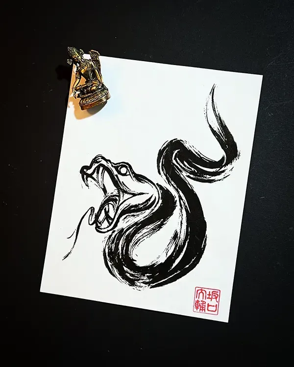 Strike with fluid, dynamic elegance. Book this bespoke Shodo-style snake concept with experienced artist Daisuke Sakaguchi at Silent Moon Tattoo (London SE16).