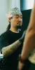 Experienced traditional Japanese tattoo artist Daisuke Sakaguchi maintains a high level of focus while working on a bespoke irezumi piece, emphasizing anatomical flow and cultural authenticity.
