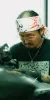 Experienced traditional Japanese tattoo artist Daisuke Sakaguchi demonstrates the precise, unwavering focus required for the high-stakes execution of bespoke Irezumi and Ukiyo-e designs.