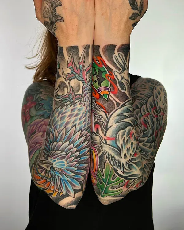 A breathtaking display of mirrored storytelling and elite color saturation. Book your custom vibrant traditional Japanese sleeves with experienced artist Daisuke Sakaguchi at Silent Moon Tattoo (London SE16).