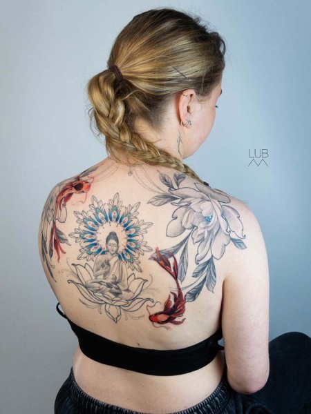Zen in motion: This custom illustrative back piece by Lubava blends spiritual Buddha symbolism with vibrant red koi and intricate mandala geometry for a seamless flow.