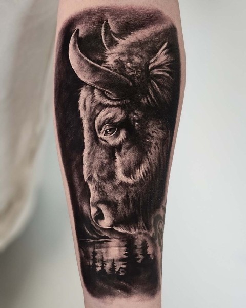 Black and grey realistic bison and forest tattoo at Silent Moon, our private tattoo studio in Bermondsey, South East London.