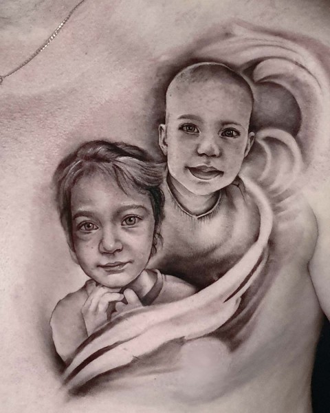 Black and grey realistic children's portrait tattoo at Silent Moon, our private tattoo studio in Bermondsey, South East London.
