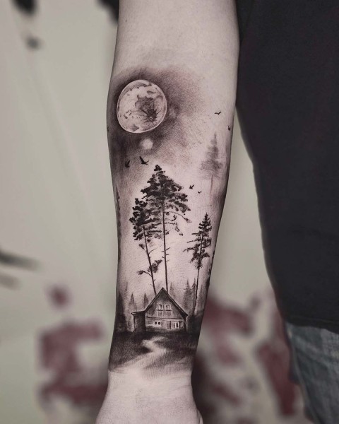 Black and grey forest, cabin and moon tattoo at Silent Moon, our private tattoo studio in Bermondsey, South East London.