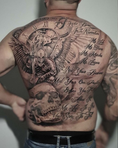Black and grey realistic warrior angel, skull and script full back tattoo at Silent Moon, our private tattoo studio in Bermondsey, South East London.