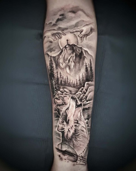 Black and grey realistic wolf, mountain and forest tattoo at Silent Moon, Bermondsey.