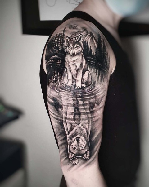 black-and-grey-wolf-reflection-tattoo-upper-arm