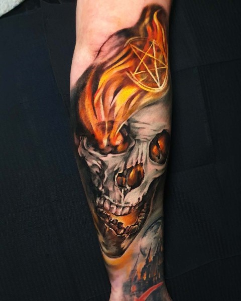 Colour realism flaming skull tattoo at Silent Moon, our private tattoo studio in Bermondsey, South East London.